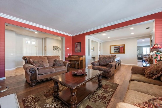 living room featuring light hardwood / wood-style floors and ornamental molding