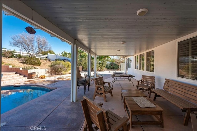 view of patio with a fenced in pool