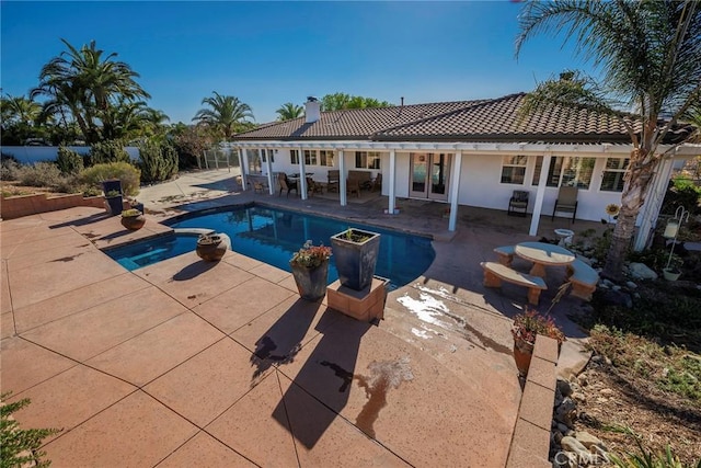 view of swimming pool featuring a patio