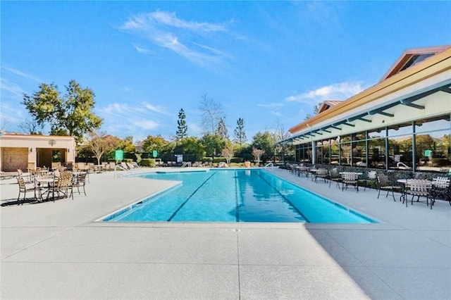 view of swimming pool with a patio area