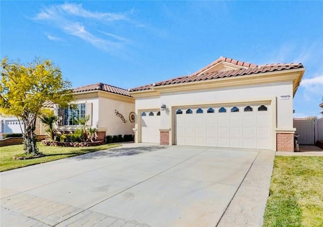 mediterranean / spanish home with a front lawn