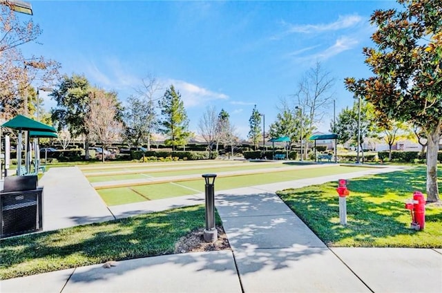 view of community featuring shuffleboard