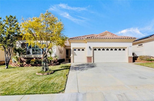 mediterranean / spanish-style home featuring a garage and a front yard