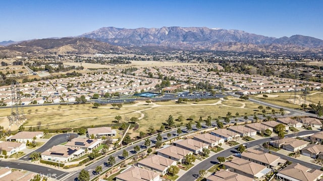 birds eye view of property with a mountain view and a residential view