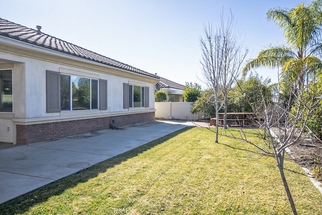 view of yard featuring a patio area and fence