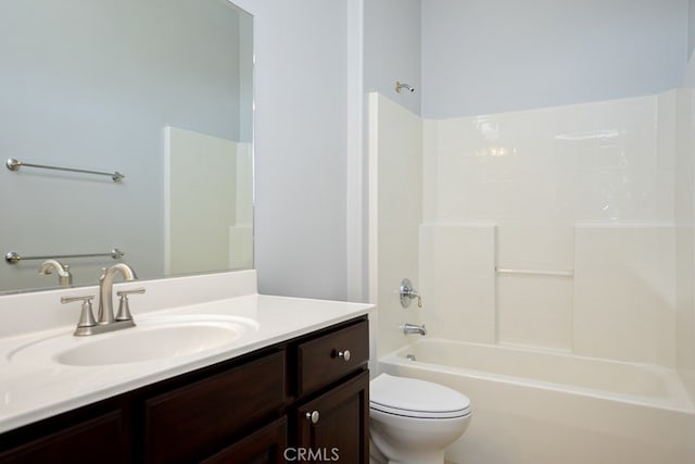 full bathroom featuring bathtub / shower combination, vanity, and toilet