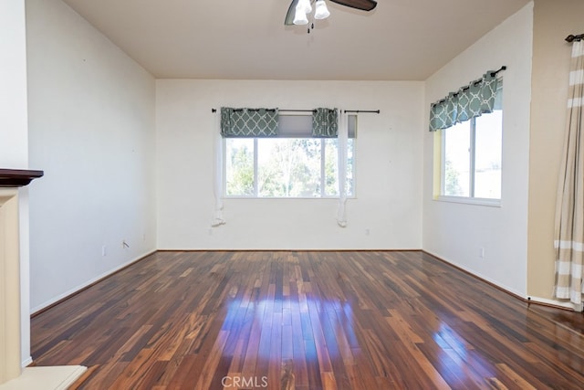 empty room with ceiling fan and hardwood / wood-style floors