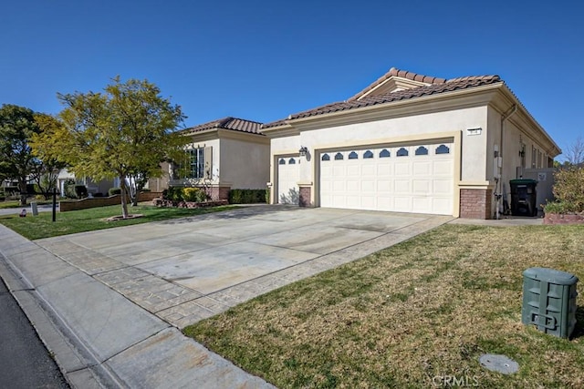 view of front of house featuring a garage and a front yard