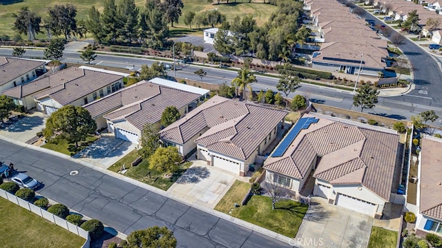 birds eye view of property with a residential view