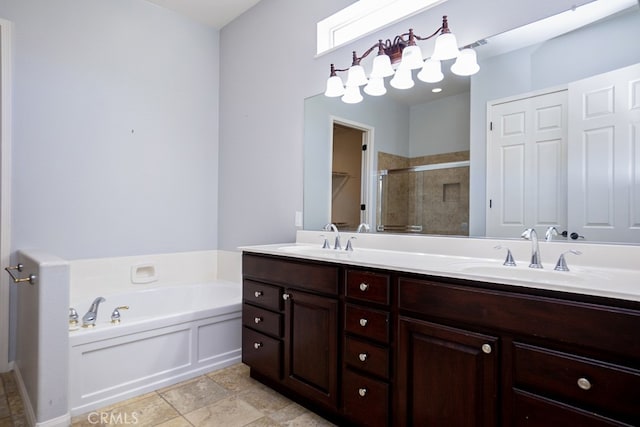 bathroom featuring double vanity, a sink, a shower stall, and a bath