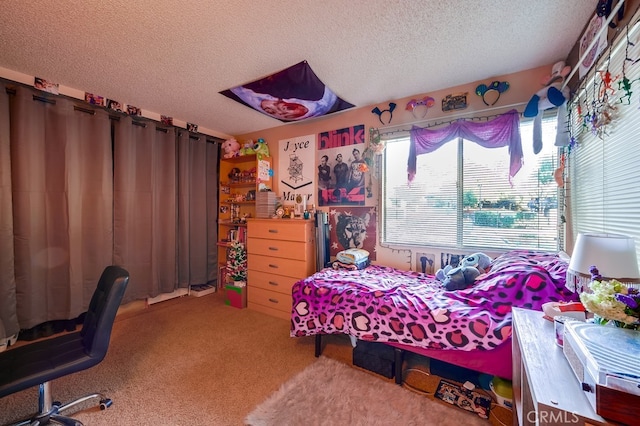 bedroom with a textured ceiling and carpet