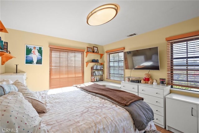 bedroom featuring multiple windows