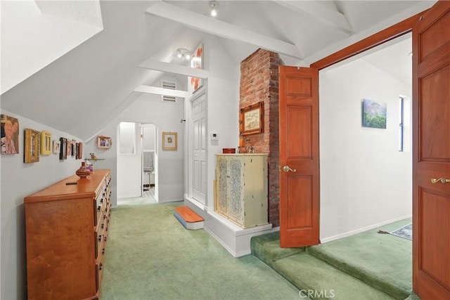 interior space featuring lofted ceiling with beams