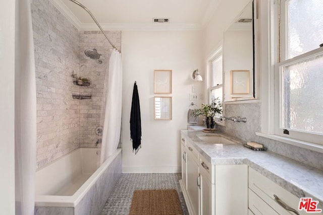 bathroom with shower / bath combo with shower curtain, tile patterned floors, vanity, and ornamental molding