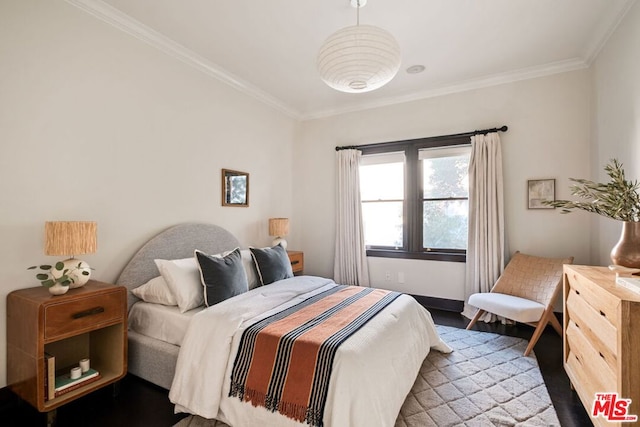 bedroom with crown molding