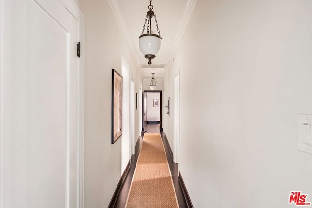 hallway featuring ornamental molding