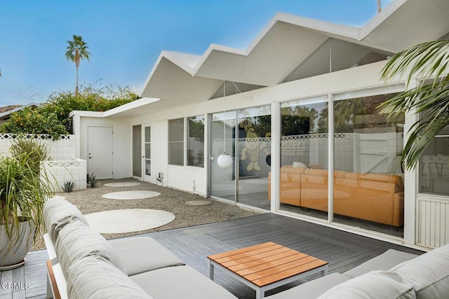 exterior space featuring a deck and an outdoor living space