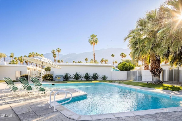 view of swimming pool featuring a mountain view