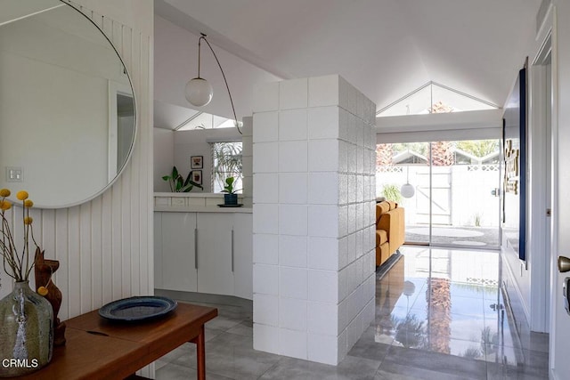 foyer entrance featuring vaulted ceiling