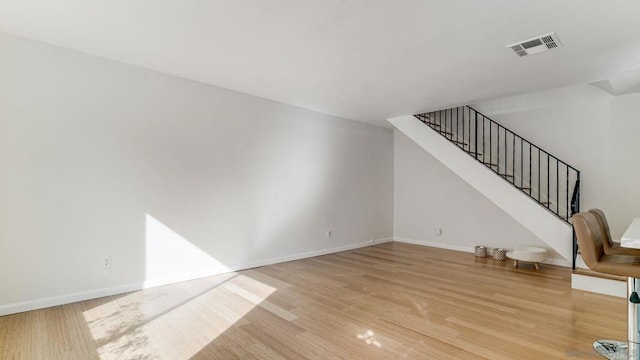 unfurnished living room featuring light wood-type flooring