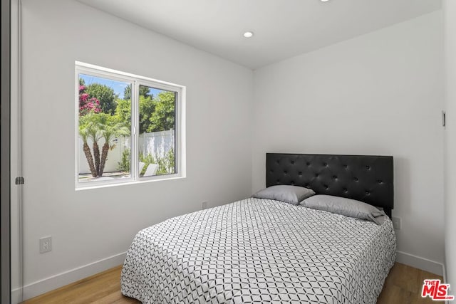 bedroom with light wood-type flooring