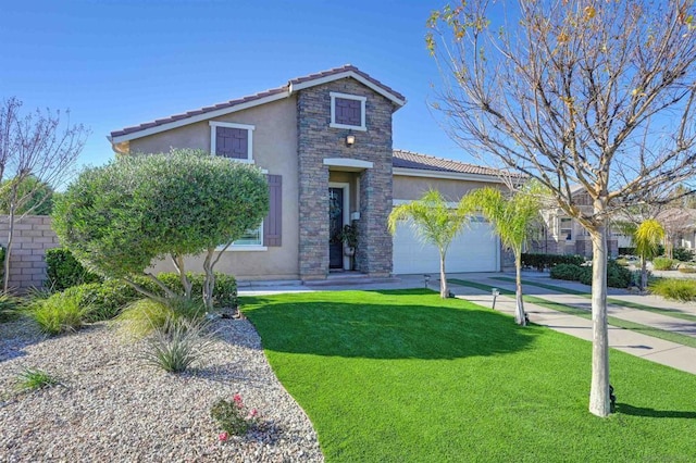 view of front of home with a front yard and a garage