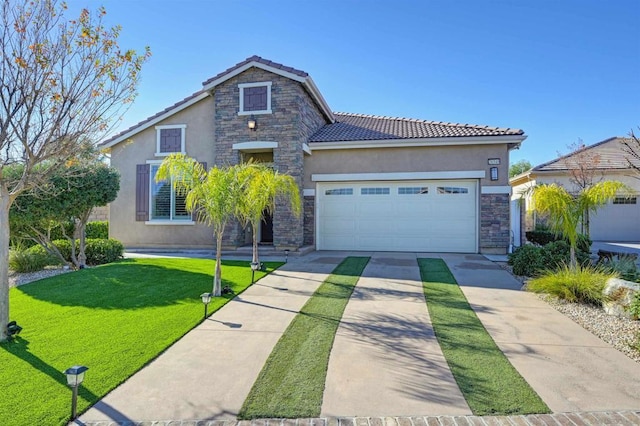 view of front of property featuring a front yard and a garage