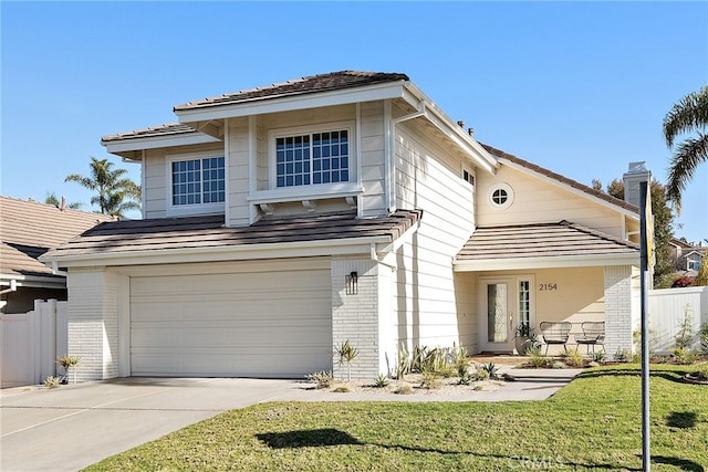 view of front property featuring a garage and a front lawn