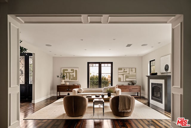 living room with dark hardwood / wood-style floors