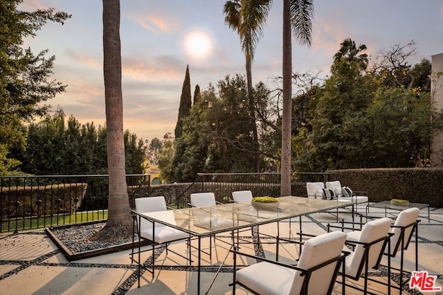 view of patio terrace at dusk