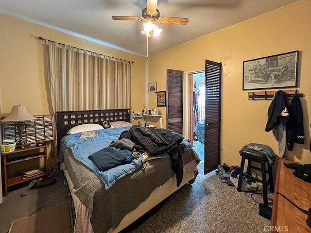 bedroom featuring carpet, lofted ceiling, and ceiling fan