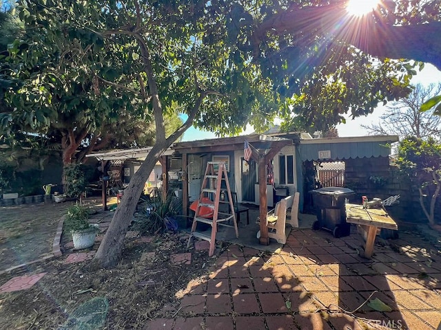 rear view of property featuring a patio