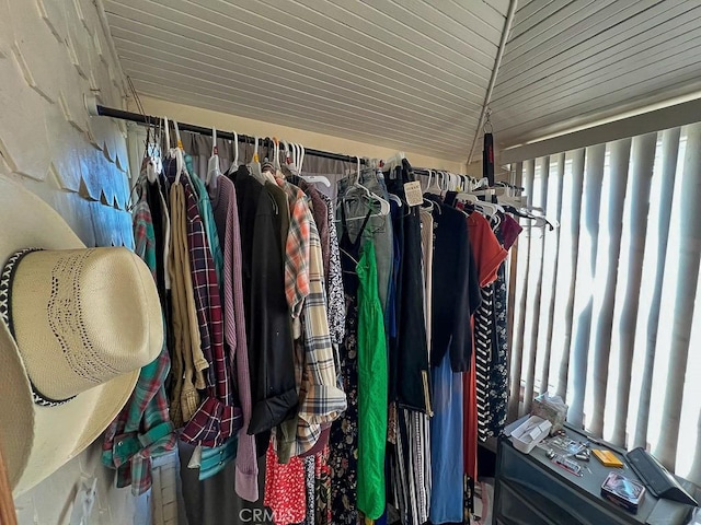 walk in closet featuring vaulted ceiling