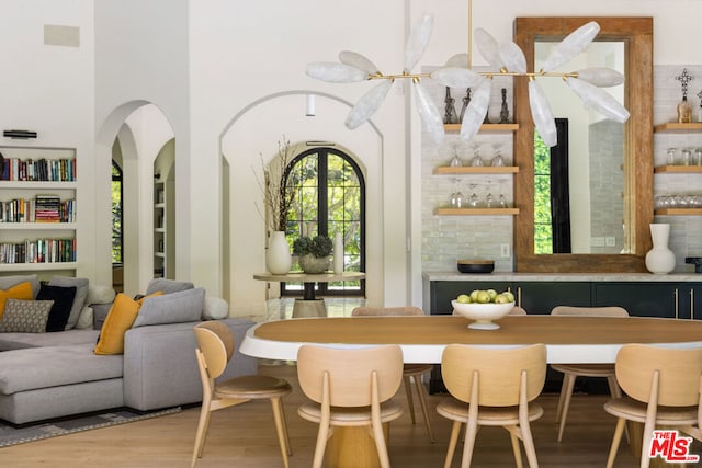 interior space featuring hardwood / wood-style floors and built in shelves