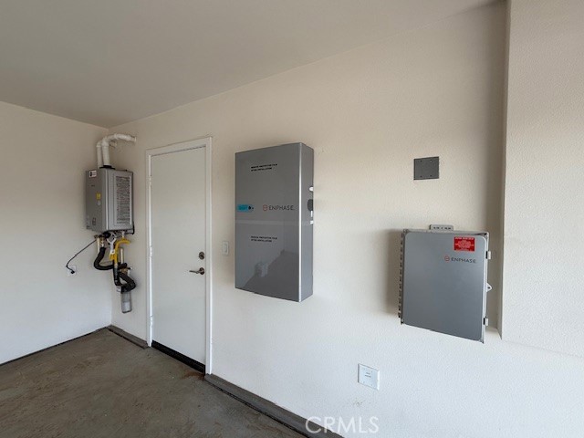 utility room with water heater