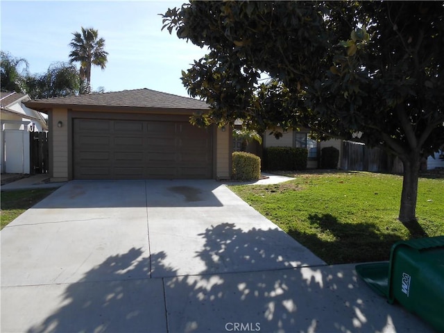 view of front of property with a garage, fence, a front lawn, and concrete driveway