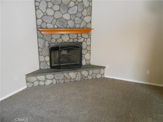 interior details with carpet flooring and a fireplace