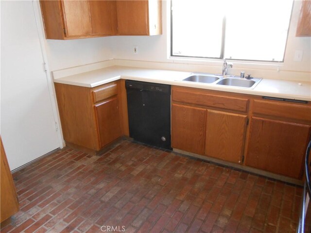 kitchen featuring sink and black dishwasher