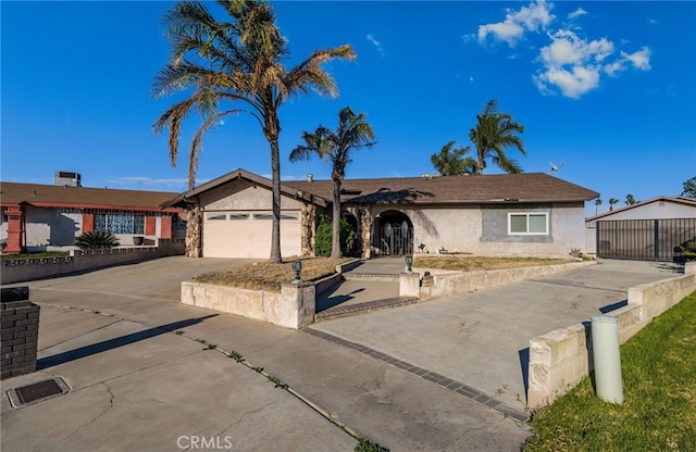 ranch-style house featuring a garage