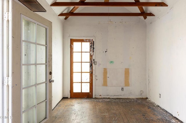 spare room with lofted ceiling with beams