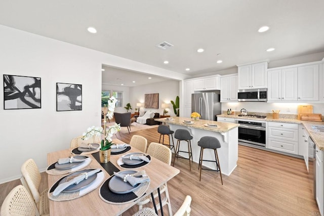 dining area featuring light hardwood / wood-style flooring