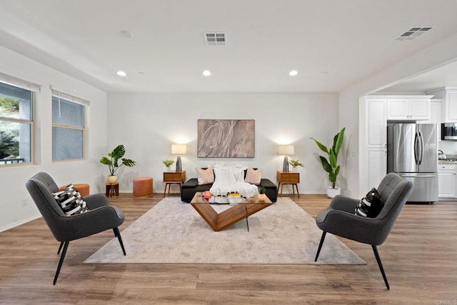 living room with light hardwood / wood-style floors