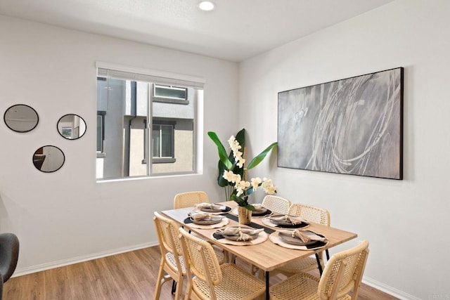 dining area with light hardwood / wood-style flooring