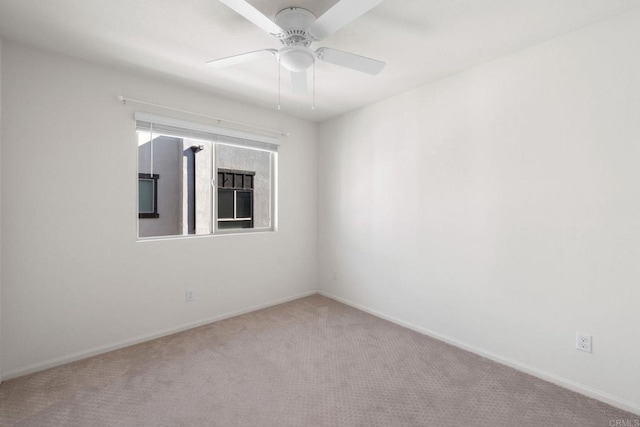 empty room with carpet and ceiling fan