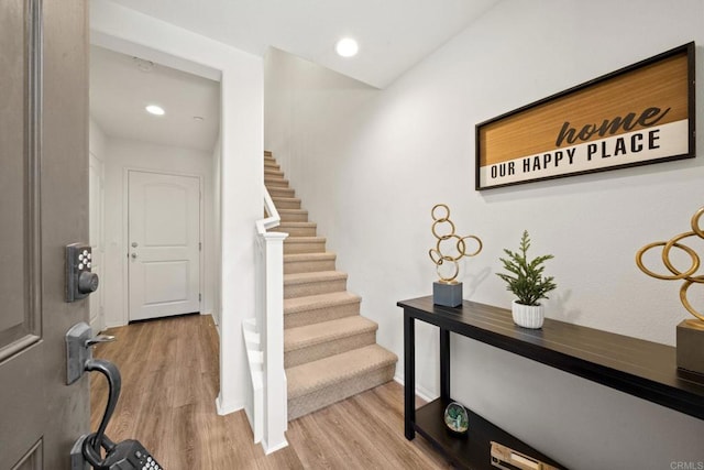 foyer entrance with hardwood / wood-style flooring