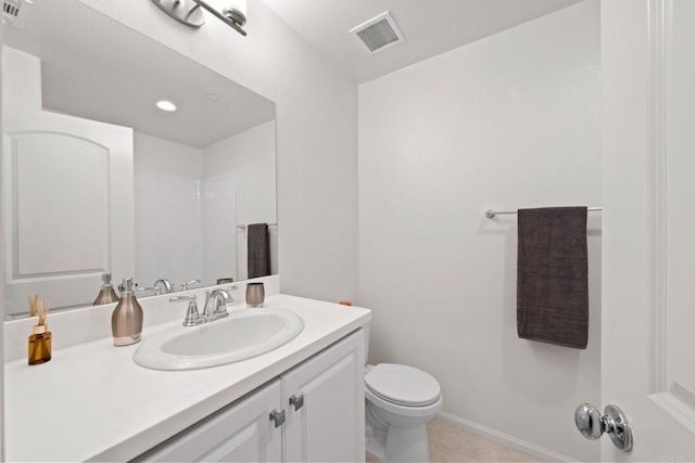 bathroom featuring toilet, tile patterned flooring, a shower, and vanity