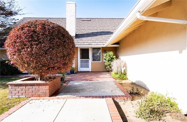 property entrance featuring a patio