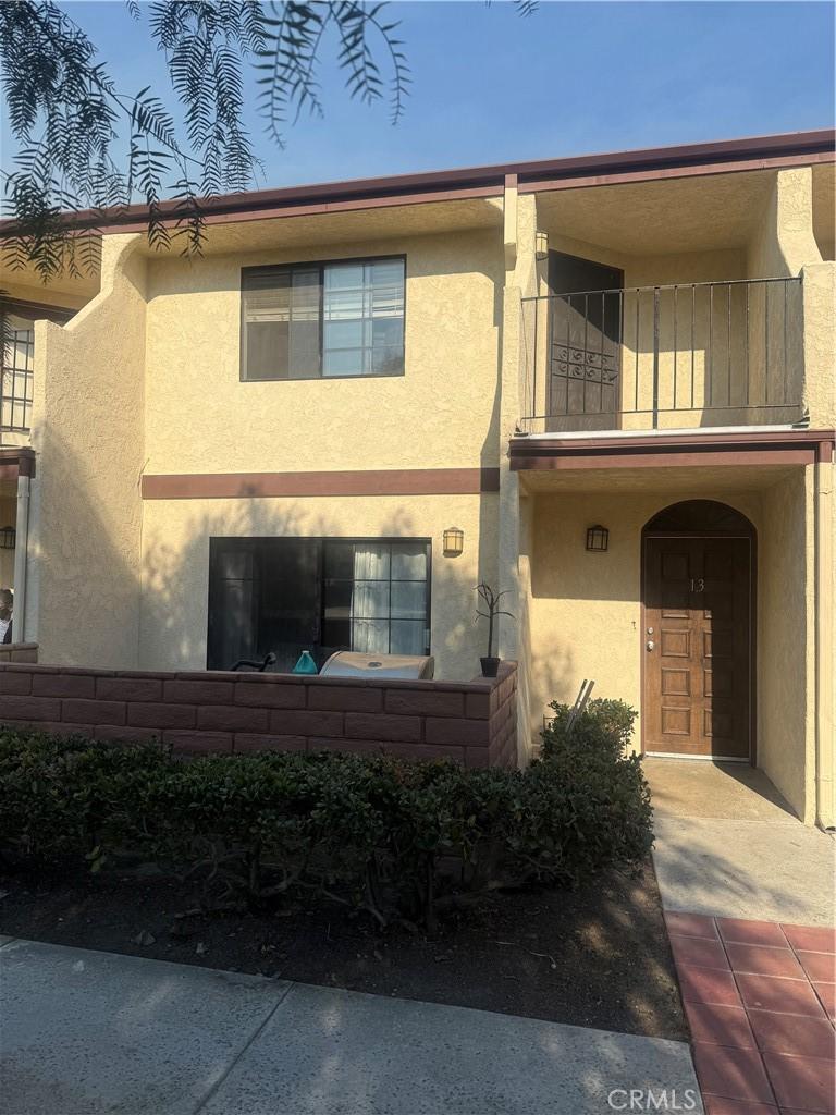 view of front of home with a balcony