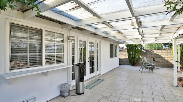 view of patio with french doors and a pergola