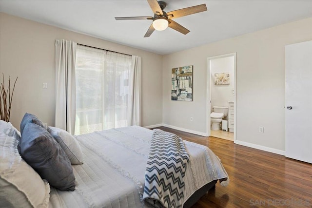 bedroom featuring ceiling fan, dark wood-type flooring, and ensuite bath